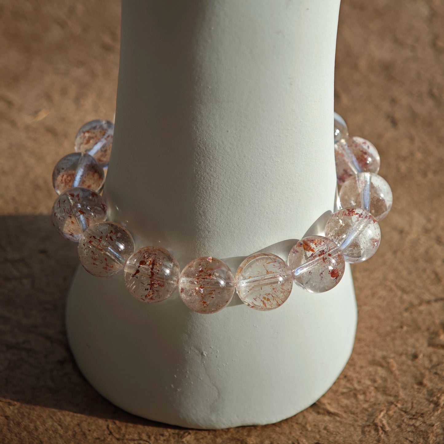 This is a golden strawberry quartz and Clear Quartz bracelet, with unique transparency and elegance.