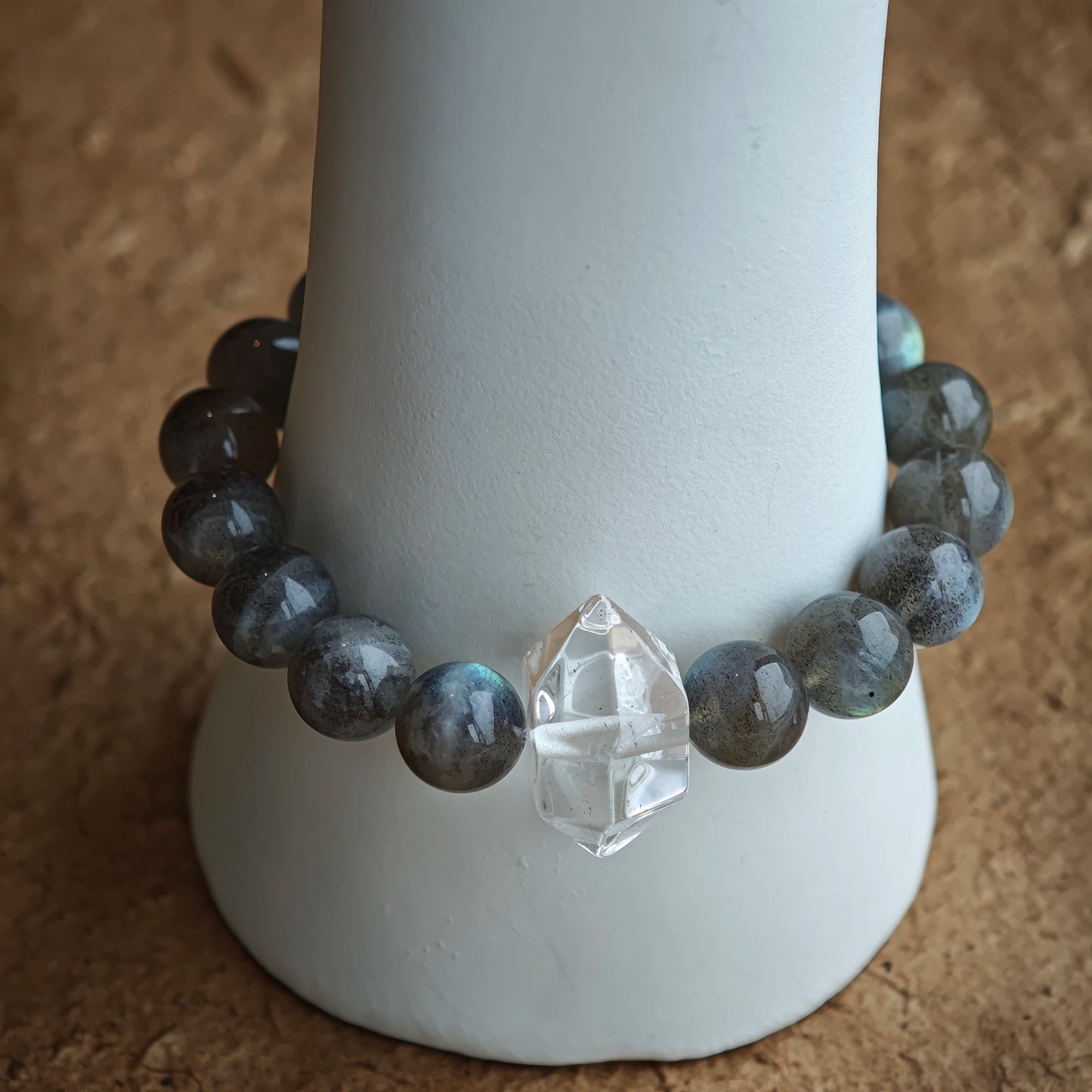 This grey moonstone bracelet consists of 17 grey moonstone and 1 clear quartz. It's mystery and elegant.