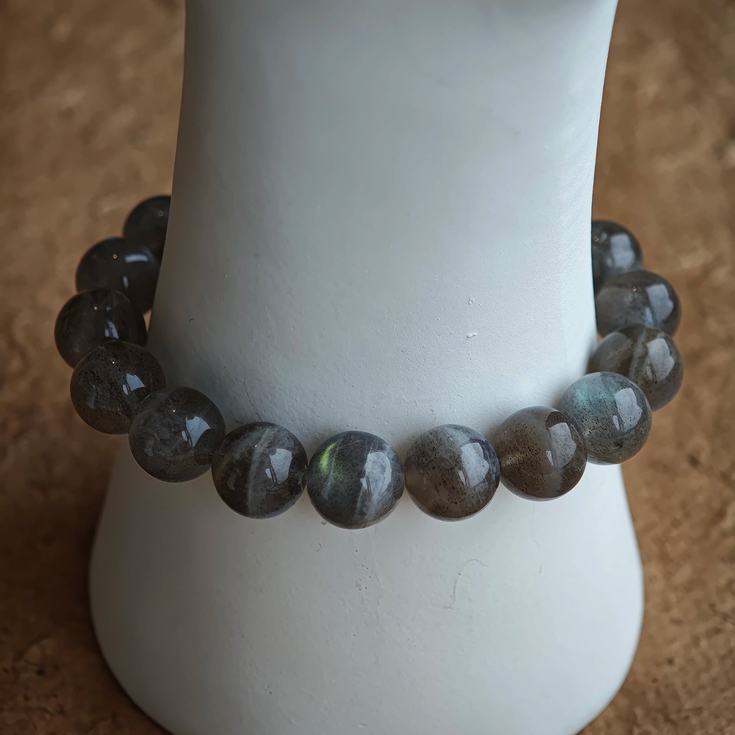This grey moonstone bracelet consists of 17 grey moonstone and 1 clear quartz. It's mystery and elegant.