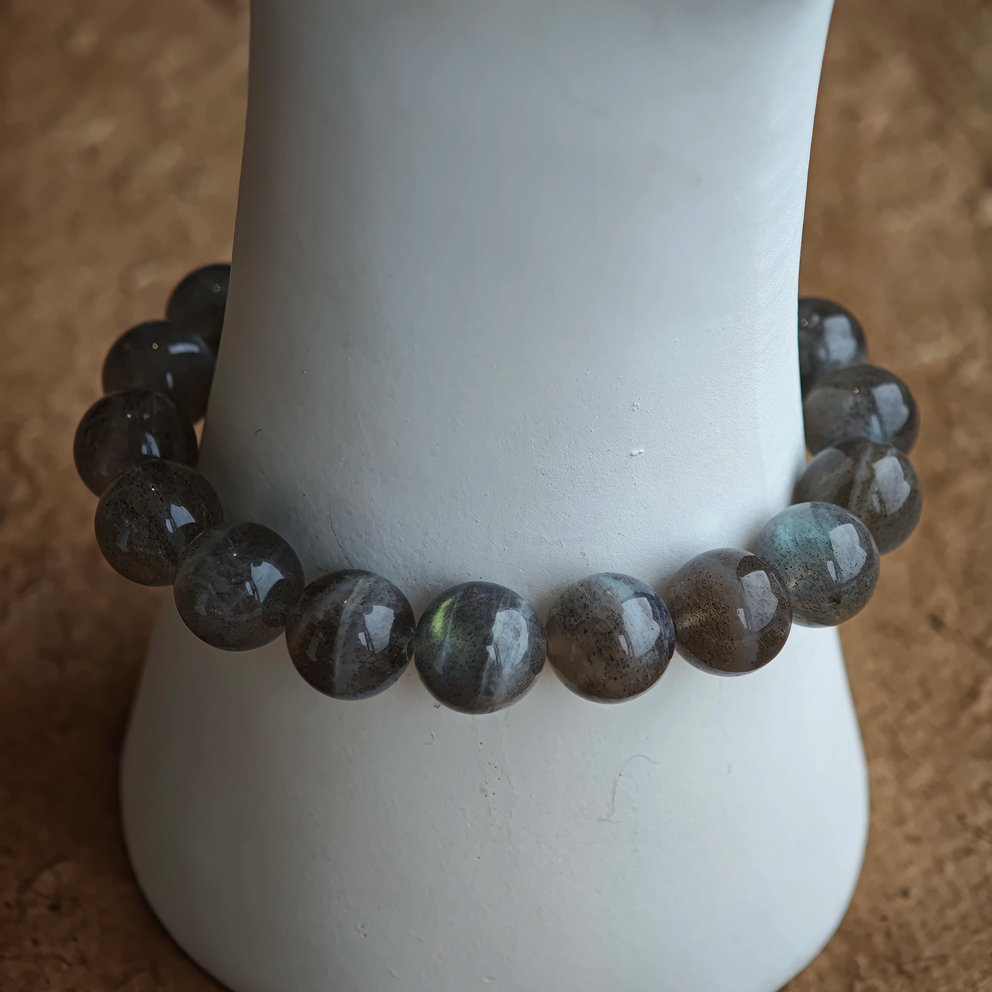 This grey moonstone bracelet consists of 17 grey moonstone and 1 clear quartz. It's mystery and elegant.