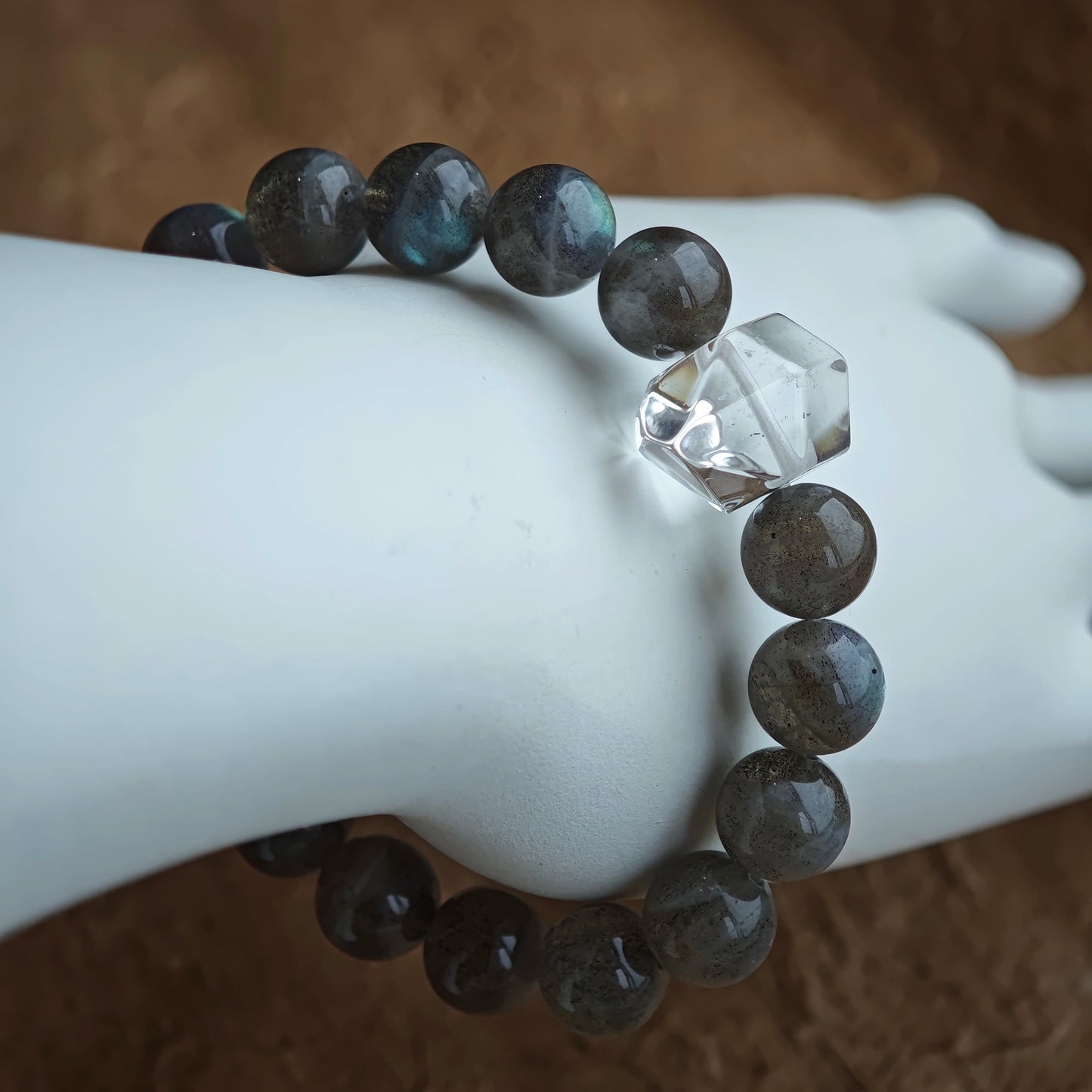 This grey moonstone bracelet consists of 17 grey moonstone and 1 clear quartz. It's mystery and elegant.