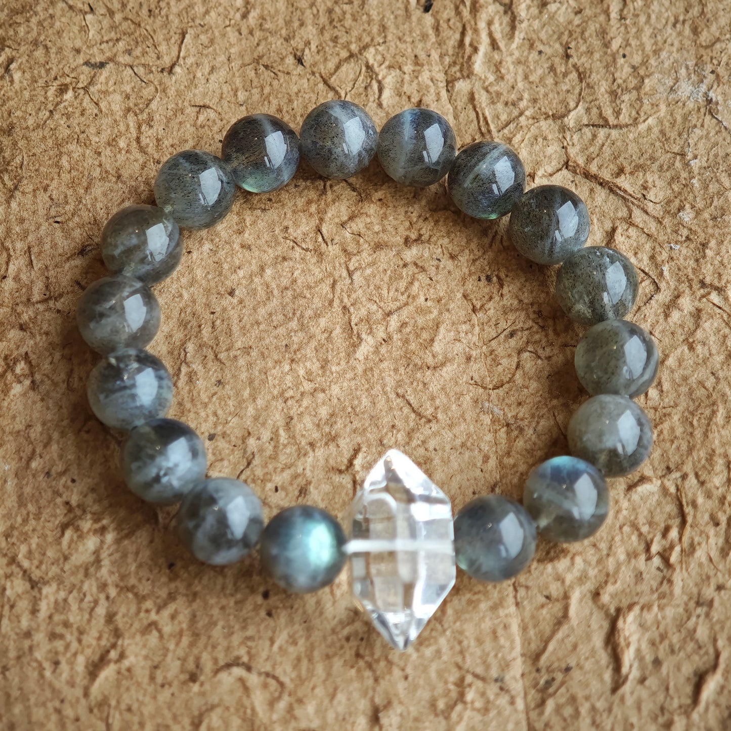 This grey moonstone bracelet consists of 17 grey moonstone and 1 clear quartz. It's mystery and elegant.