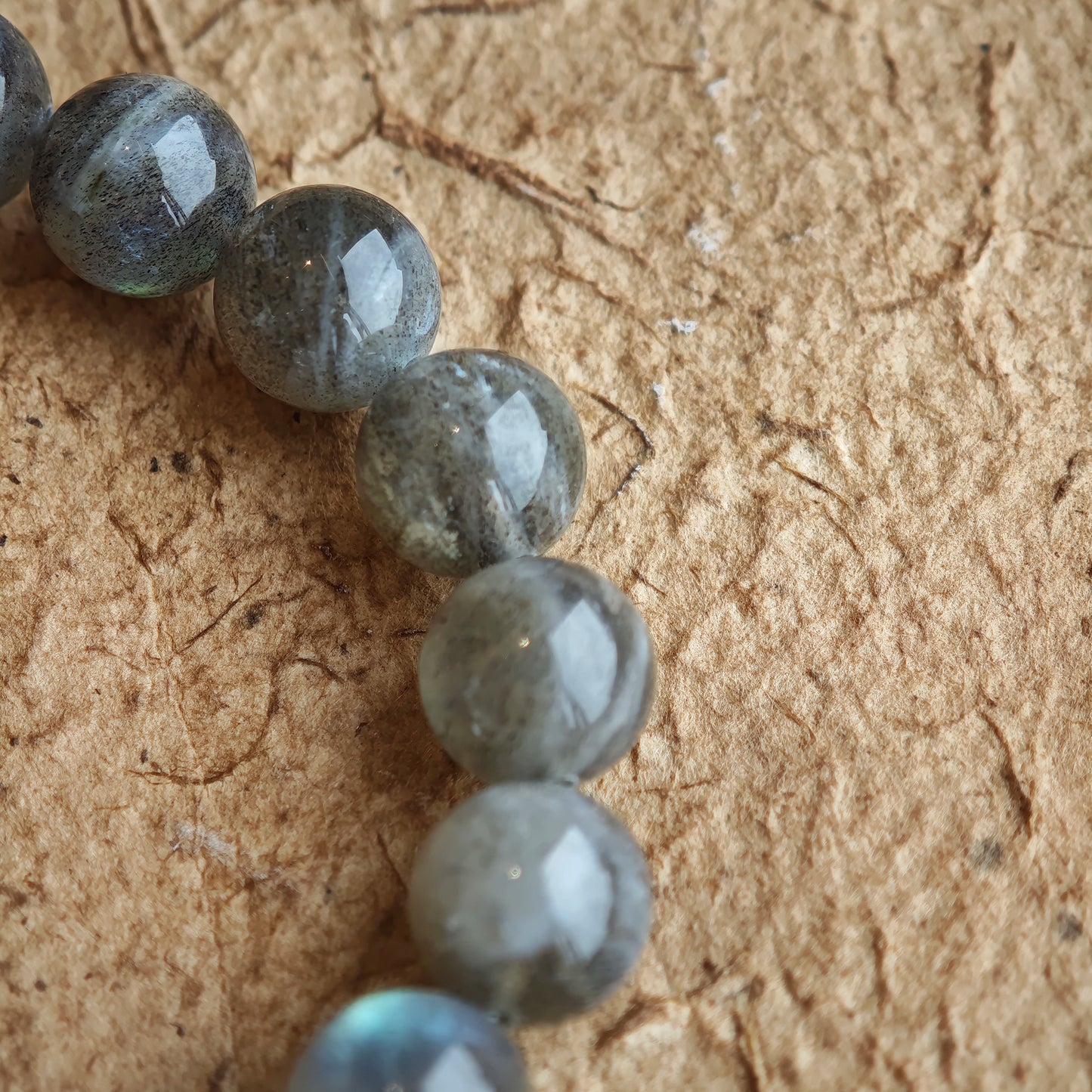 This grey moonstone bracelet consists of 17 grey moonstone and 1 clear quartz. It's mystery and elegant.