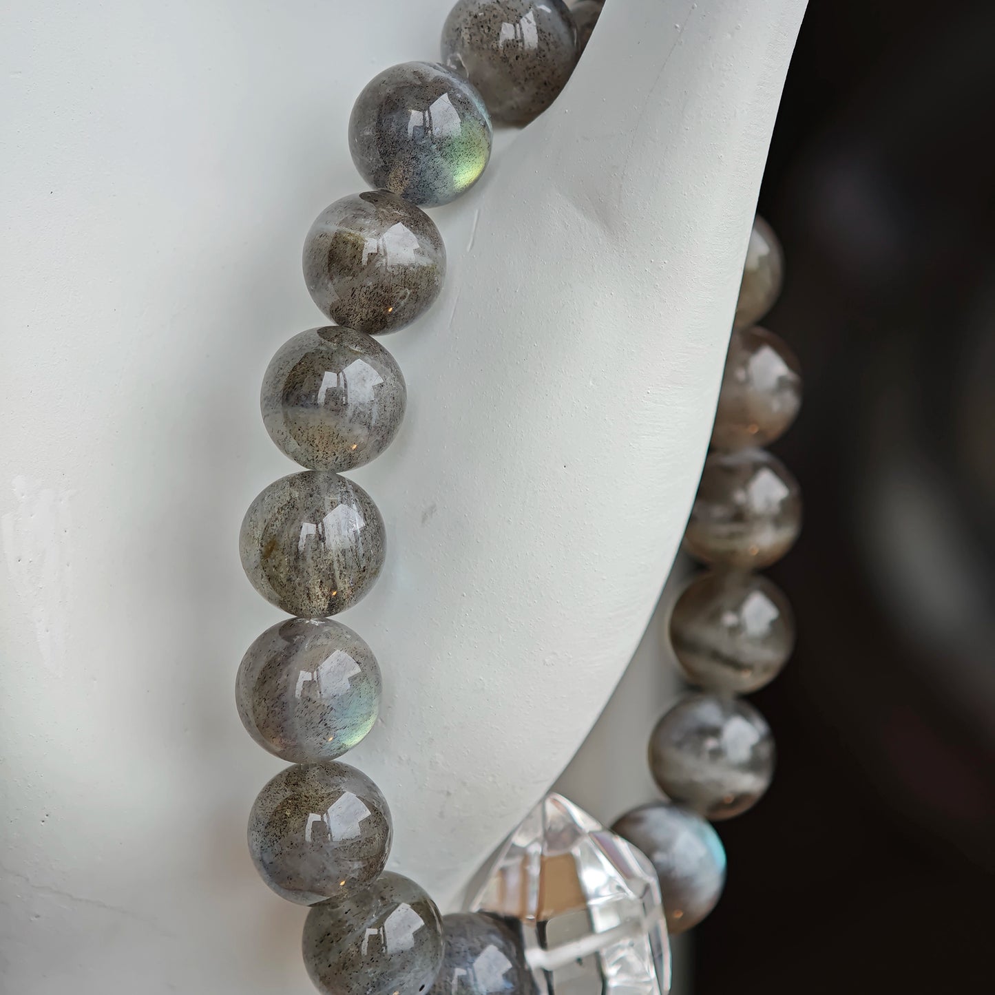 This grey moonstone bracelet consists of 17 grey moonstone and 1 clear quartz. It's mystery and elegant.