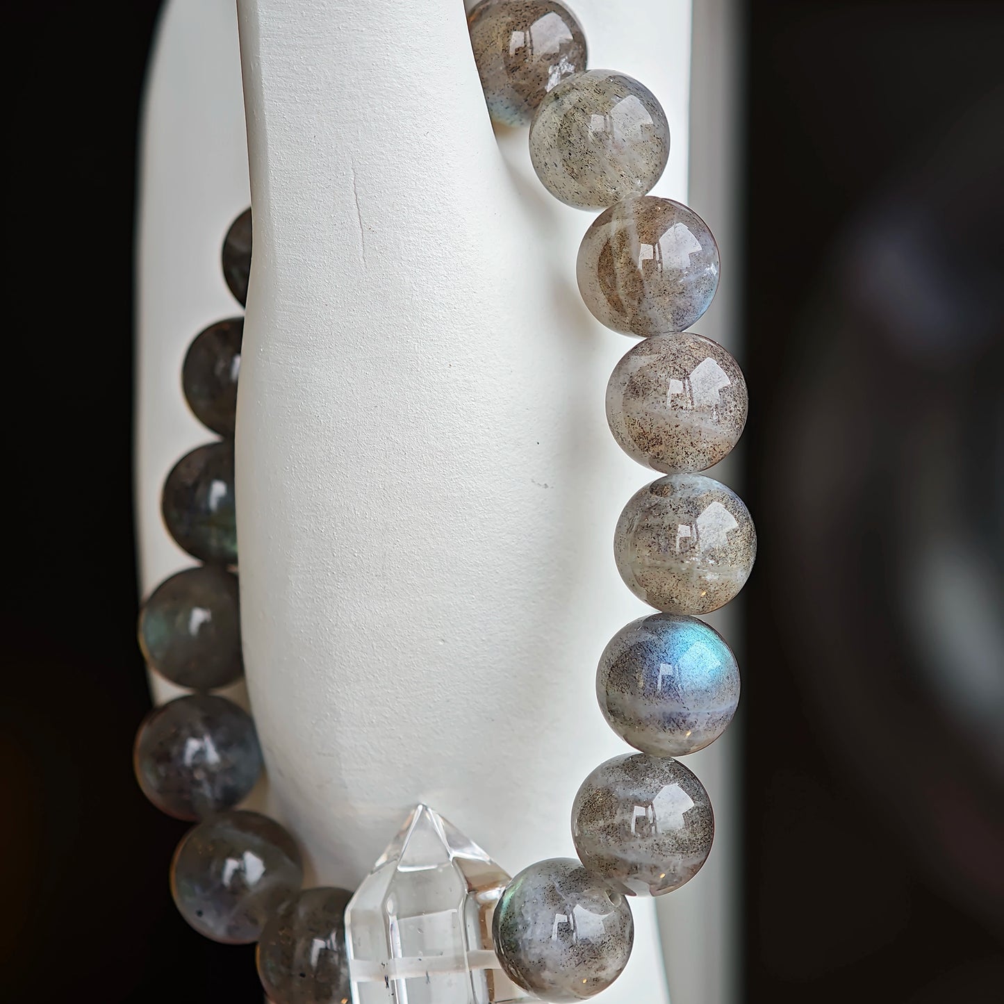 This grey moonstone bracelet consists of 17 grey moonstone and 1 clear quartz. It's mystery and elegant.