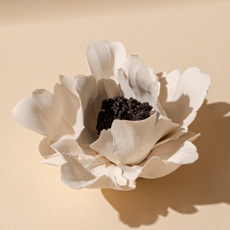 This is a ceramic flower incense stick holder with a lifelike flower. Each ceramic flower is individually hand-shaped using traditional ceramic craftsmanship. The ceramic flower is with diameter of 8cm and height of 4.3cm.