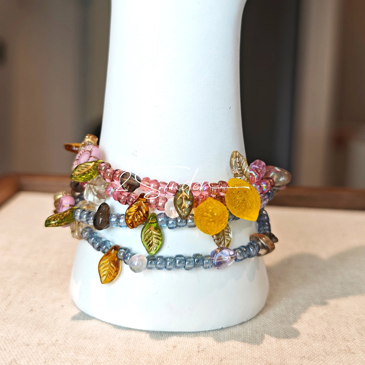 This bracelet features shimmering Czech glass beads in beautiful shades of blue, all hand-strung on a delicate double chain. An 18k gold-plated magnetic clasp makes it super easy to wear, and it's designed for a 15cm wrist.