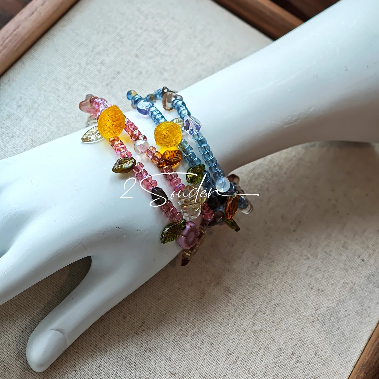 This bracelet features shimmering Czech glass beads in beautiful shades of blue, all hand-strung on a delicate double chain. An 18k gold-plated magnetic clasp makes it super easy to wear, and it's designed for a 15cm wrist.