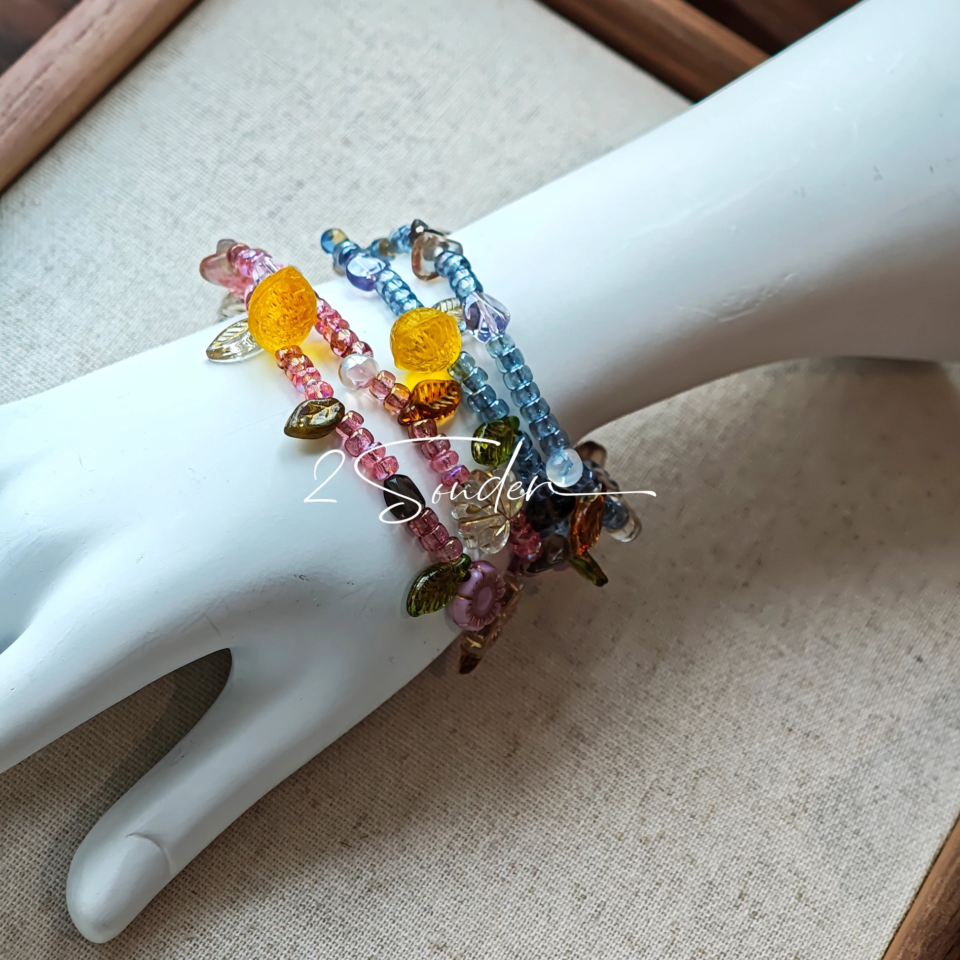 This bracelet features shimmering Czech glass beads in beautiful shades of blue, all hand-strung on a delicate double chain. An 18k gold-plated magnetic clasp makes it super easy to wear, and it's designed for a 15cm wrist.