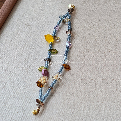 This bracelet features shimmering Czech glass beads in beautiful shades of blue, all hand-strung on a delicate double chain. An 18k gold-plated magnetic clasp makes it super easy to wear, and it's designed for a 15cm wrist.