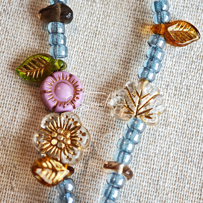 This bracelet features shimmering Czech glass beads in beautiful shades of blue, all hand-strung on a delicate double chain. An 18k gold-plated magnetic clasp makes it super easy to wear, and it's designed for a 15cm wrist.