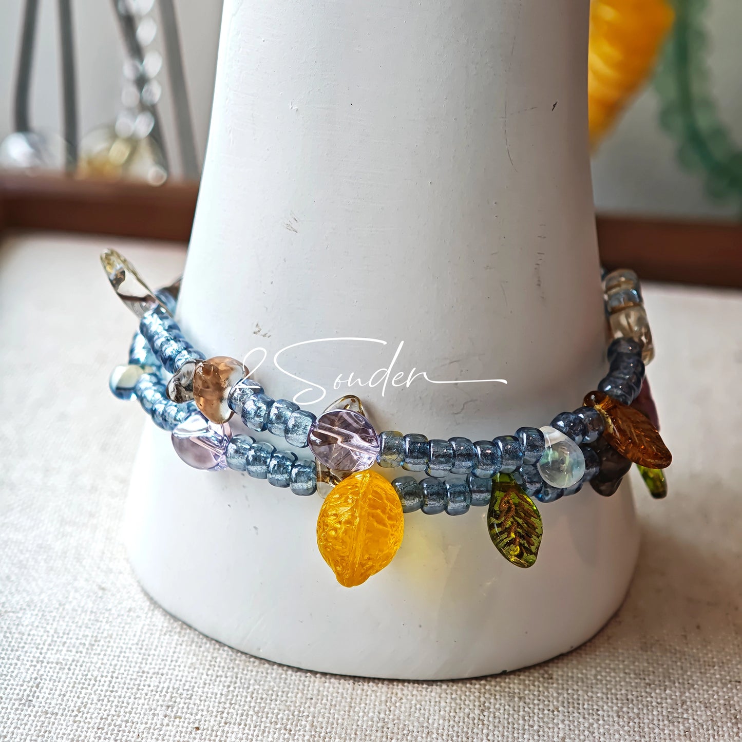 This bracelet features shimmering Czech glass beads in beautiful shades of blue, all hand-strung on a delicate double chain. An 18k gold-plated magnetic clasp makes it super easy to wear, and it's designed for a 15cm wrist.