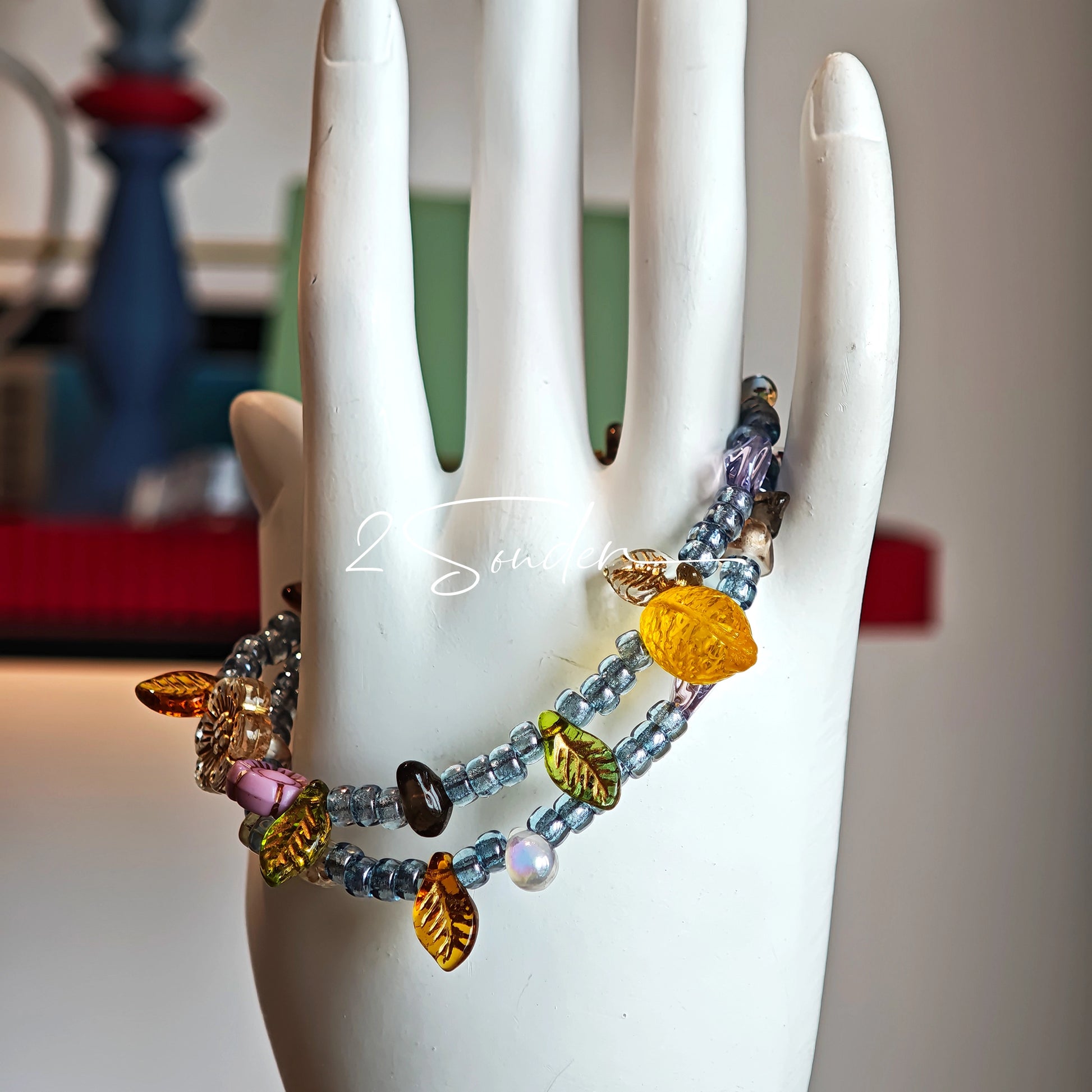 This bracelet features shimmering Czech glass beads in beautiful shades of blue, all hand-strung on a delicate double chain. An 18k gold-plated magnetic clasp makes it super easy to wear, and it's designed for a 15cm wrist.