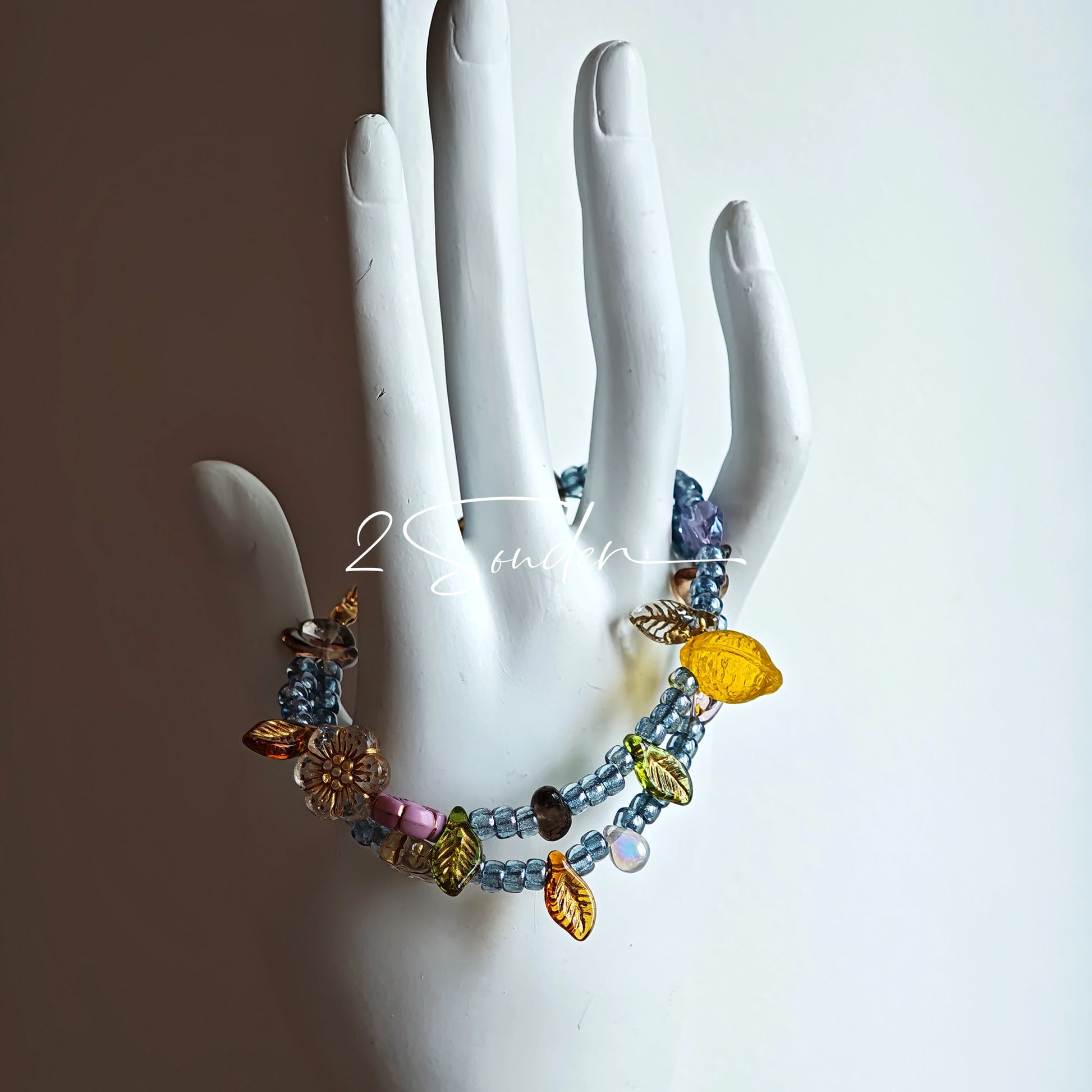 This bracelet features shimmering Czech glass beads in beautiful shades of blue, all hand-strung on a delicate double chain. An 18k gold-plated magnetic clasp makes it super easy to wear, and it's designed for a 15cm wrist.