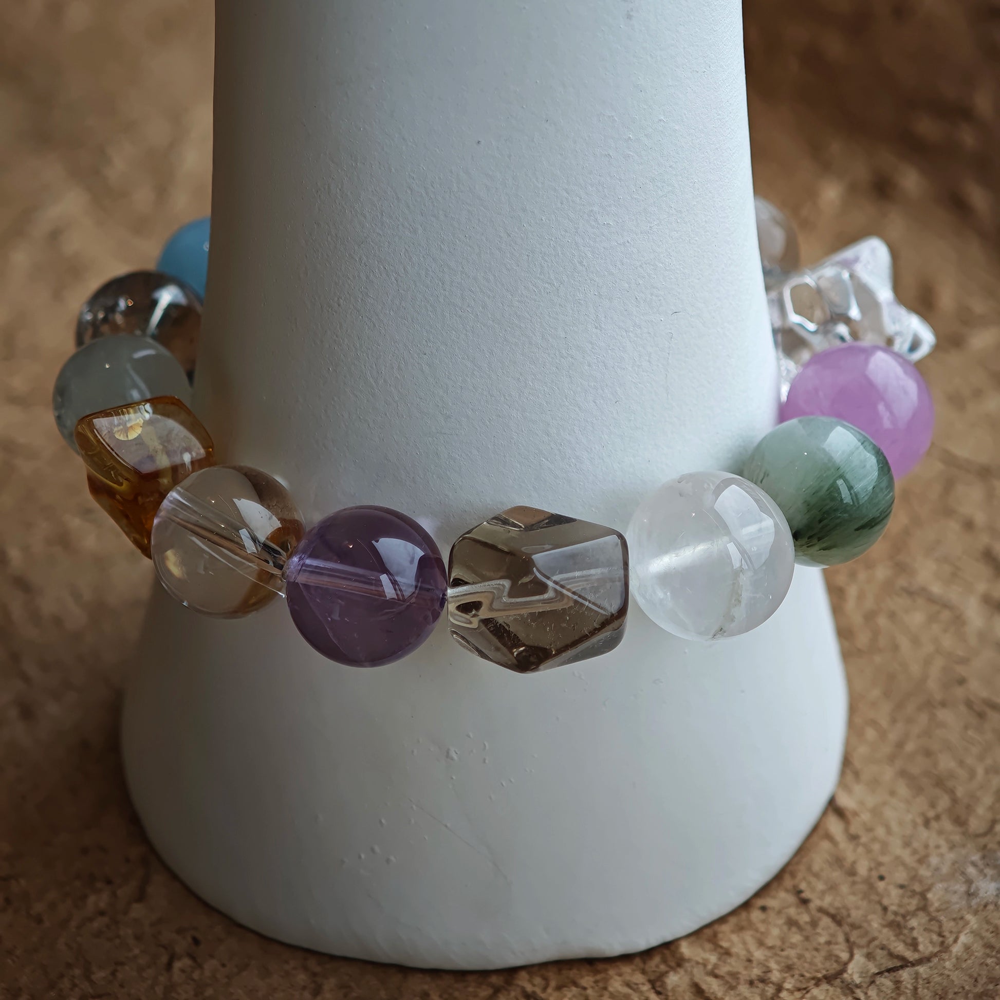 Big, smooth beads carry ocean serenity, royal insight, golden optimism, green healing, and cloudy wisdom.