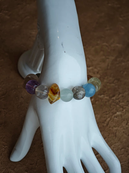 Gentle aquamarine embraces amethyst nobility beside citrine warmth, prehnite softness, and phantom mystery.