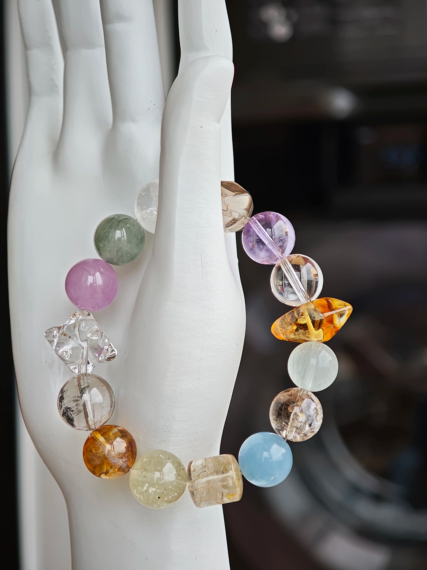 A quiet symphony of aquamarine, amethyst, citrine, prehnite, and phantom quartz plays on your wrist.