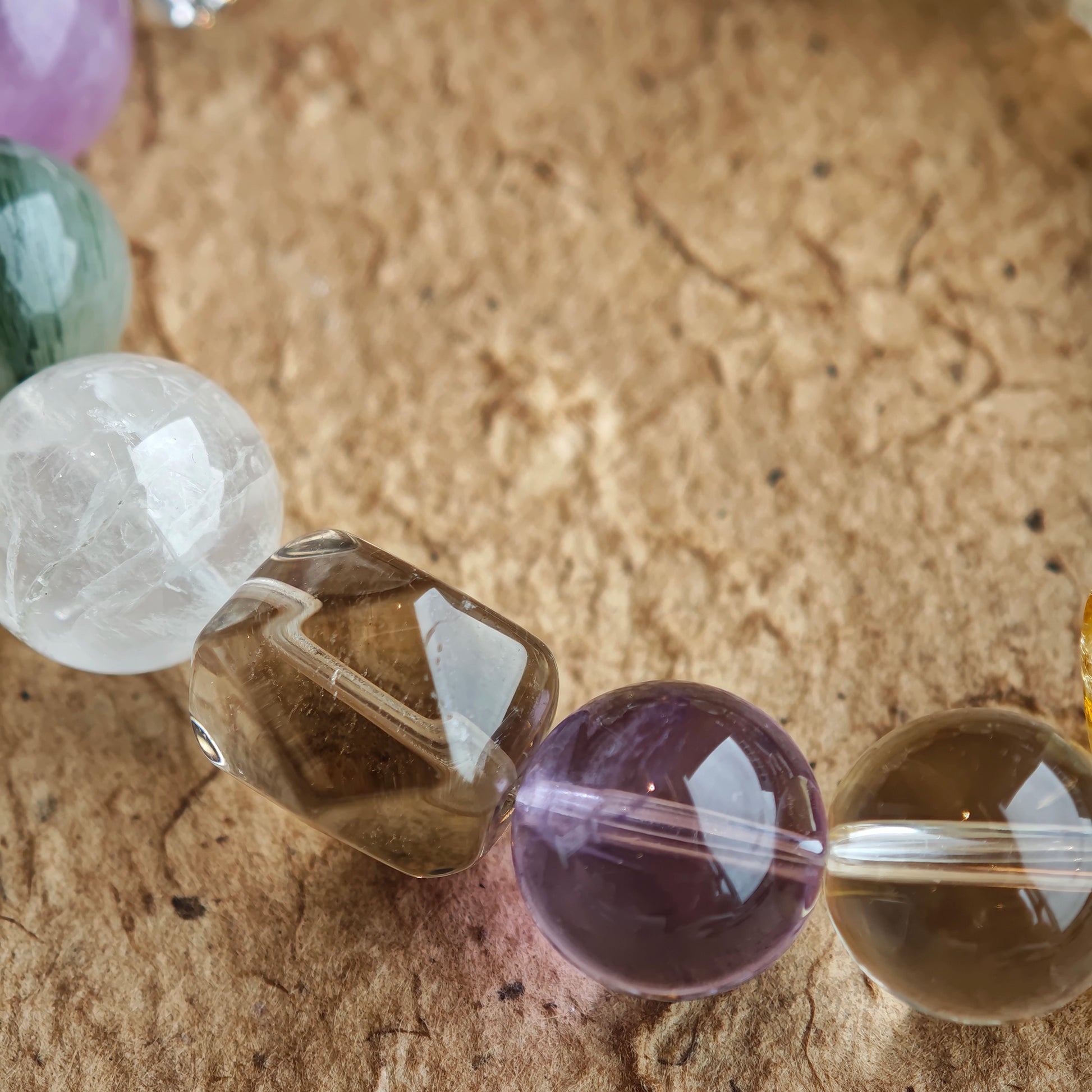 The bracelet strings ocean, twilight, sunlight, meadow, and cloud into a single, smooth gradient.