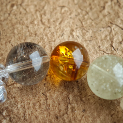 Each 13-13.8 mm bead is a pastel brushstroke—blue, purple, gold, green, white—painting effortless harmony.