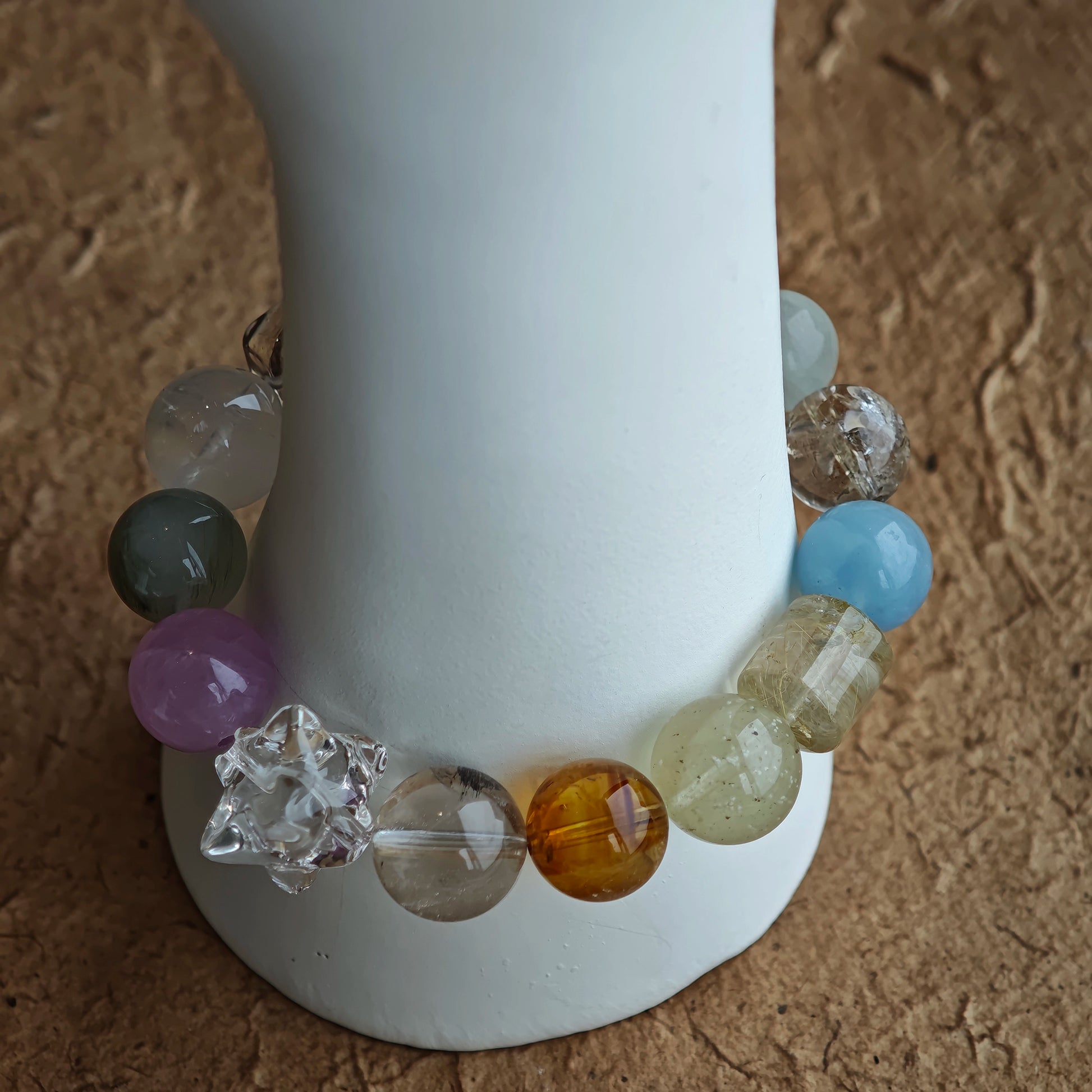 A seamless wave of pale aqua, violet, honey, mint, and mist rolls through the 13 mm spheres of Harmony Treasures.