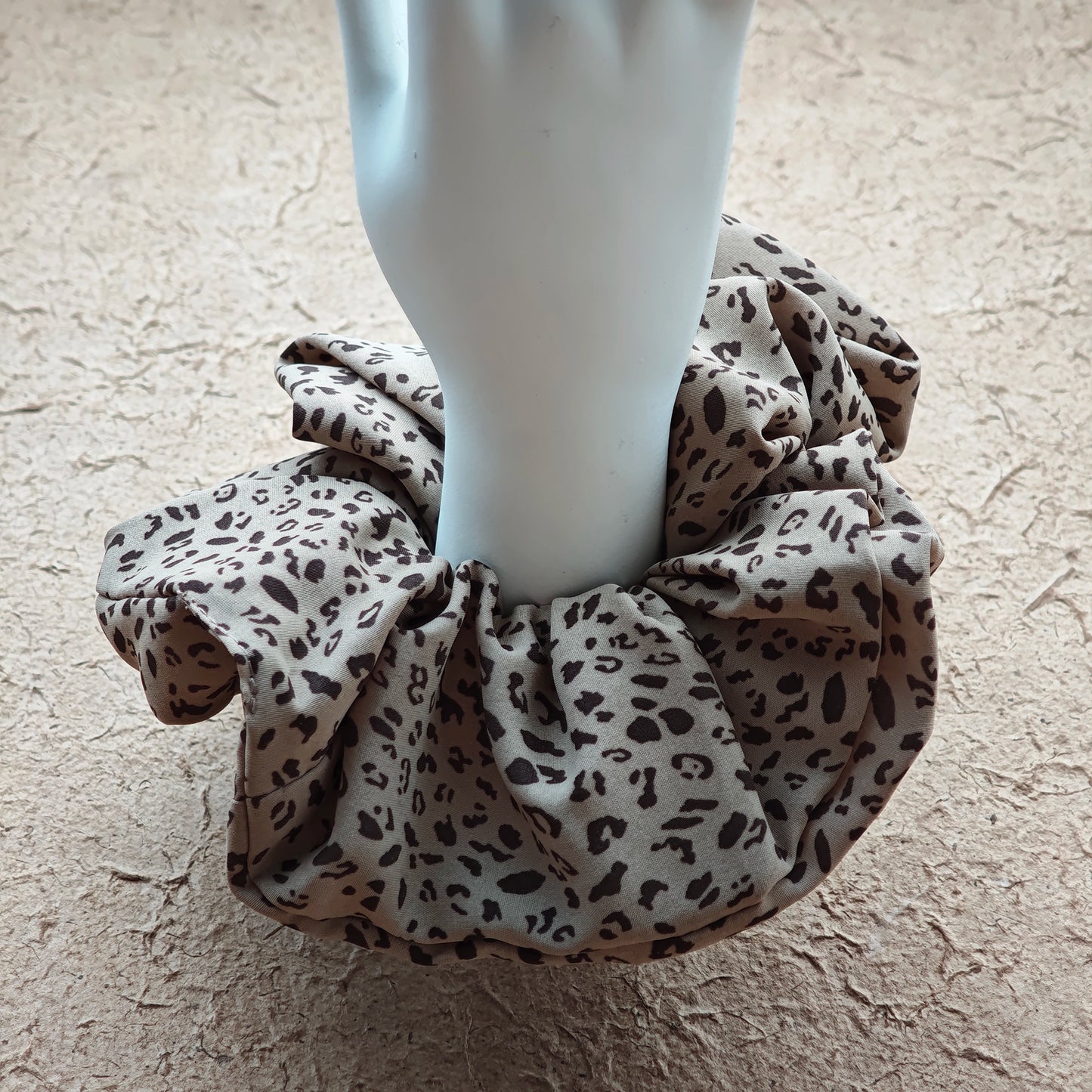 A leopard print scrunchy set with 6pcs of scrunchies, with different sizes and colors.