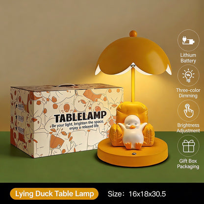 This is a bedside lamp with a design of a duck lying in a yellow sofa. And it comes with a round lampshade. Smooth rounded lines and artistic detailing make it a decorative bedside lamp and a comforting companion after long workdays.