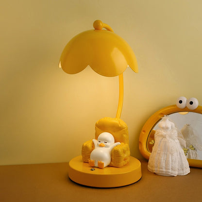 This is a bedside lamp with a design of a duck lying in a yellow sofa. And it comes with a round lampshade. Smooth rounded lines and artistic detailing make it a decorative bedside lamp and a comforting companion after long workdays.