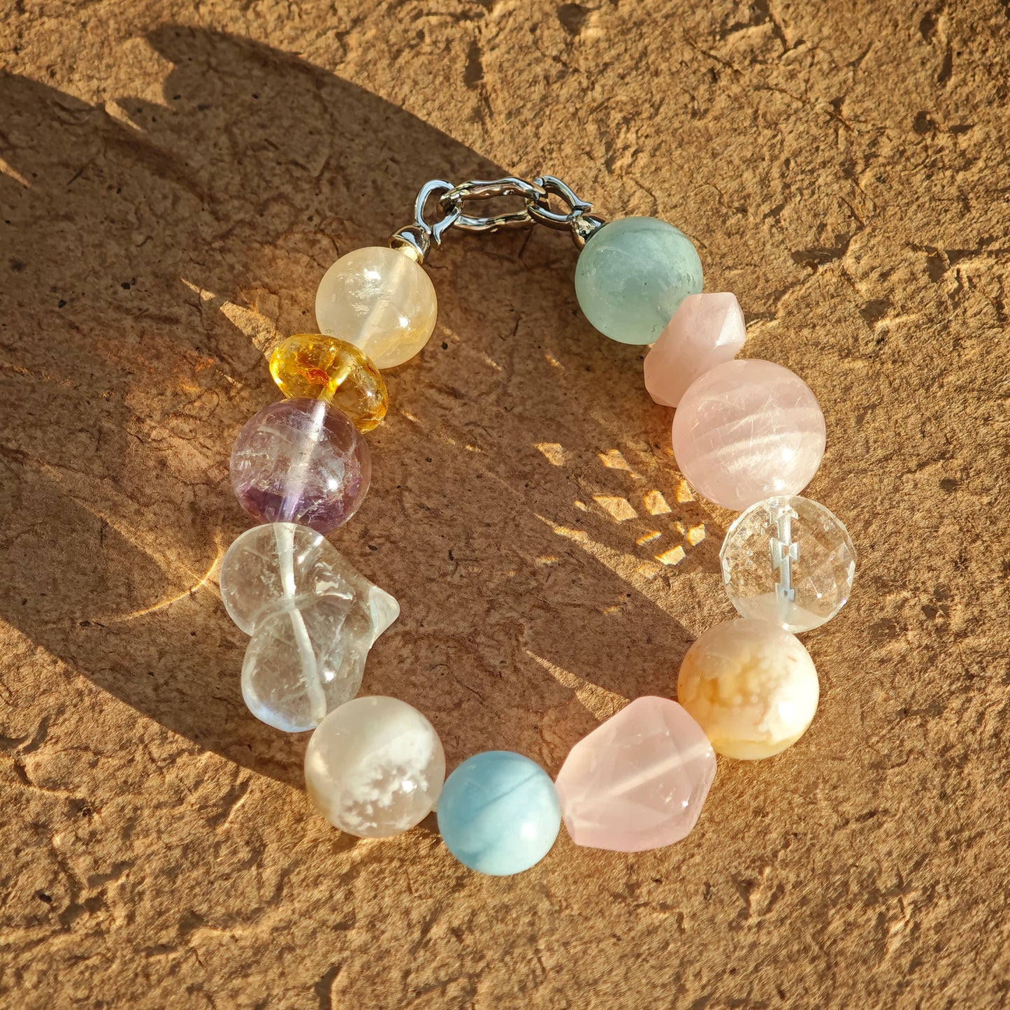 A macaron-hued bracelet spun from aquamarine, rose quartz, clear quartz, citrine, and amethyst.
