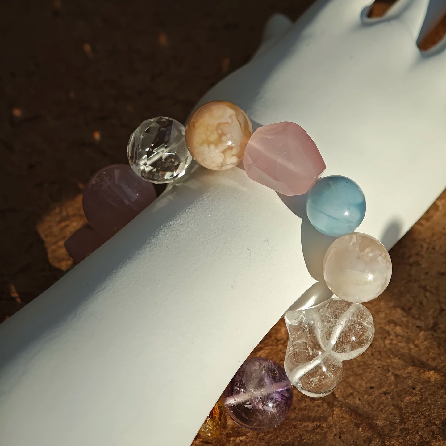 This strand marries aquamarine’s sky blue to rose quartz blush, clear quartz ice, citrine sun, and amethyst dusk.