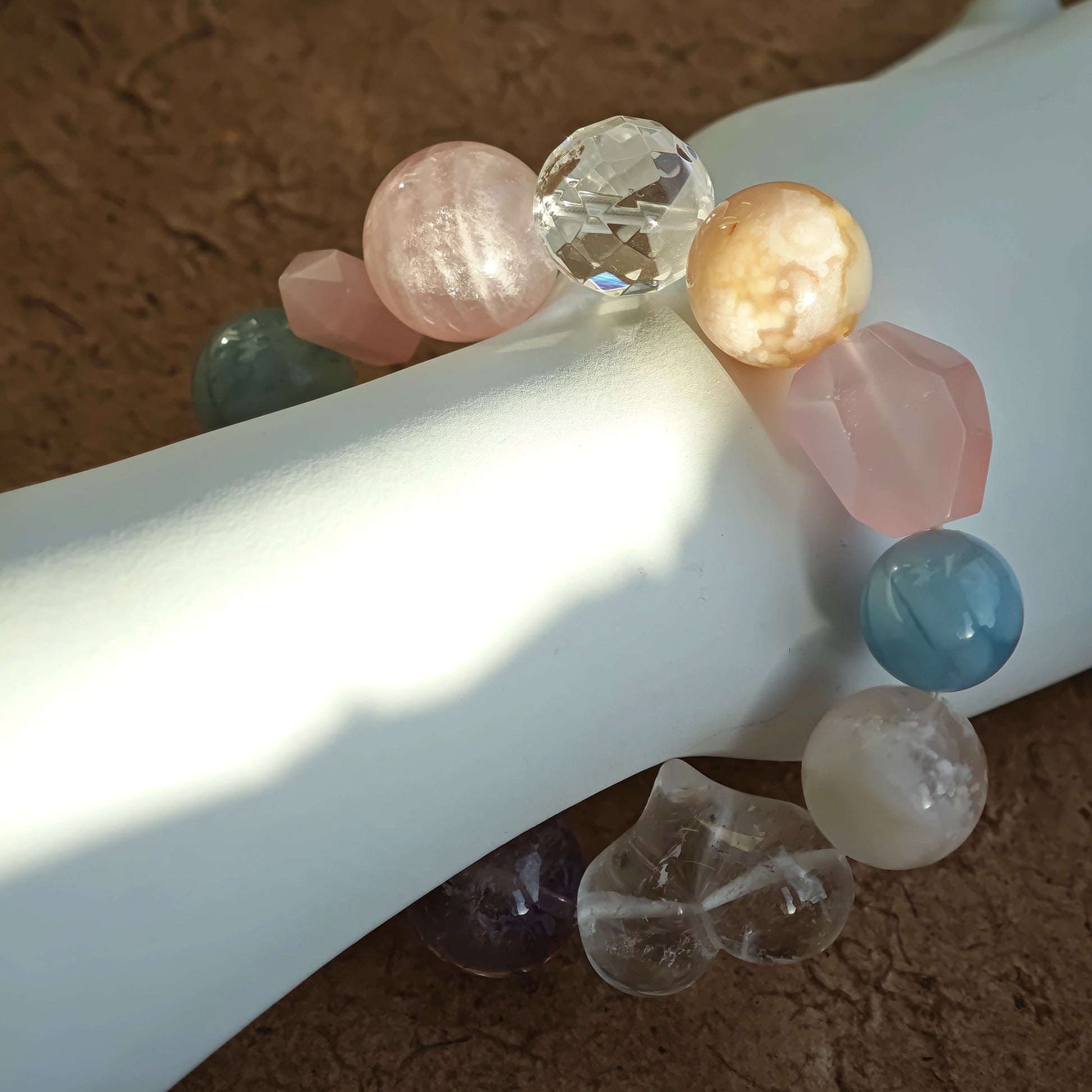 Like a box of macarons, the bracelet pairs aquamarine, rose quartz, clear quartz, citrine, and amethyst.
