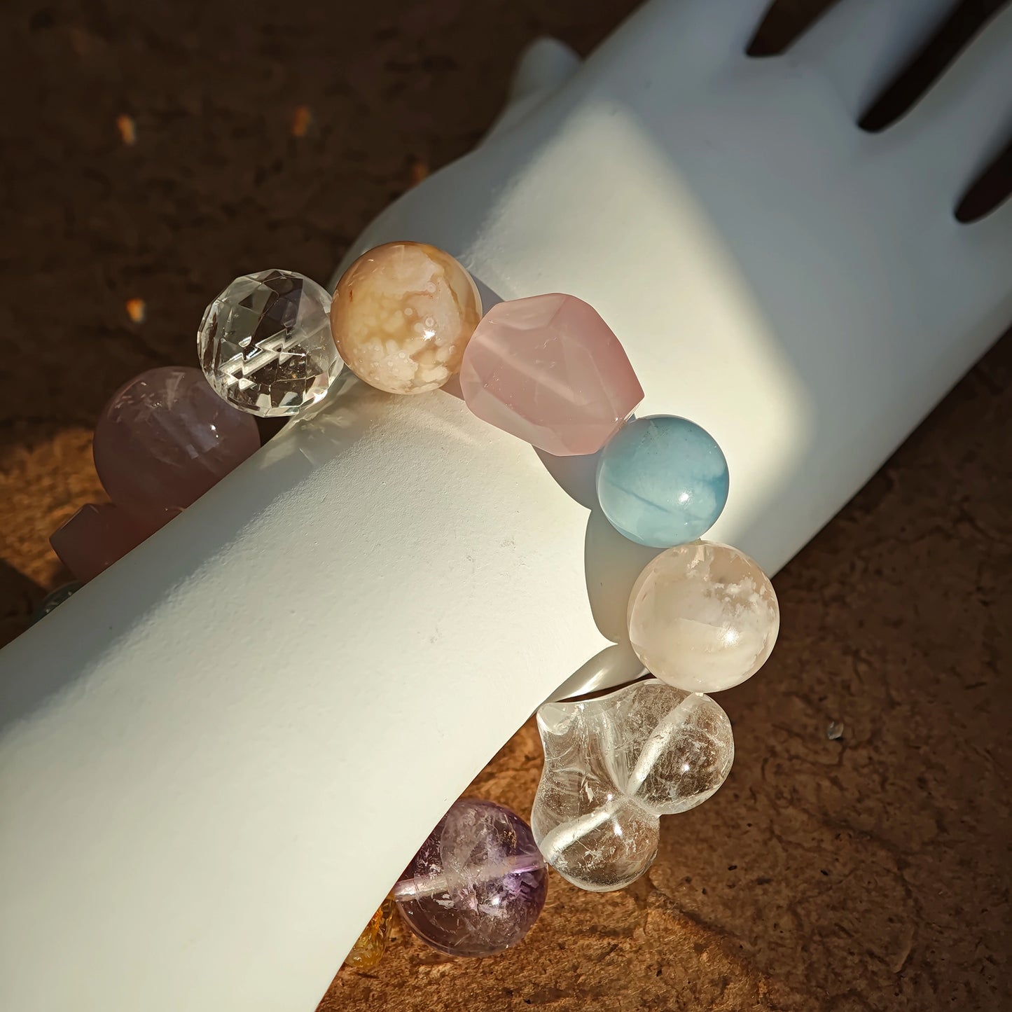 Pastel candy colors bloom in this strand of aquamarine, rose quartz, clear quartz, citrine, and amethyst.