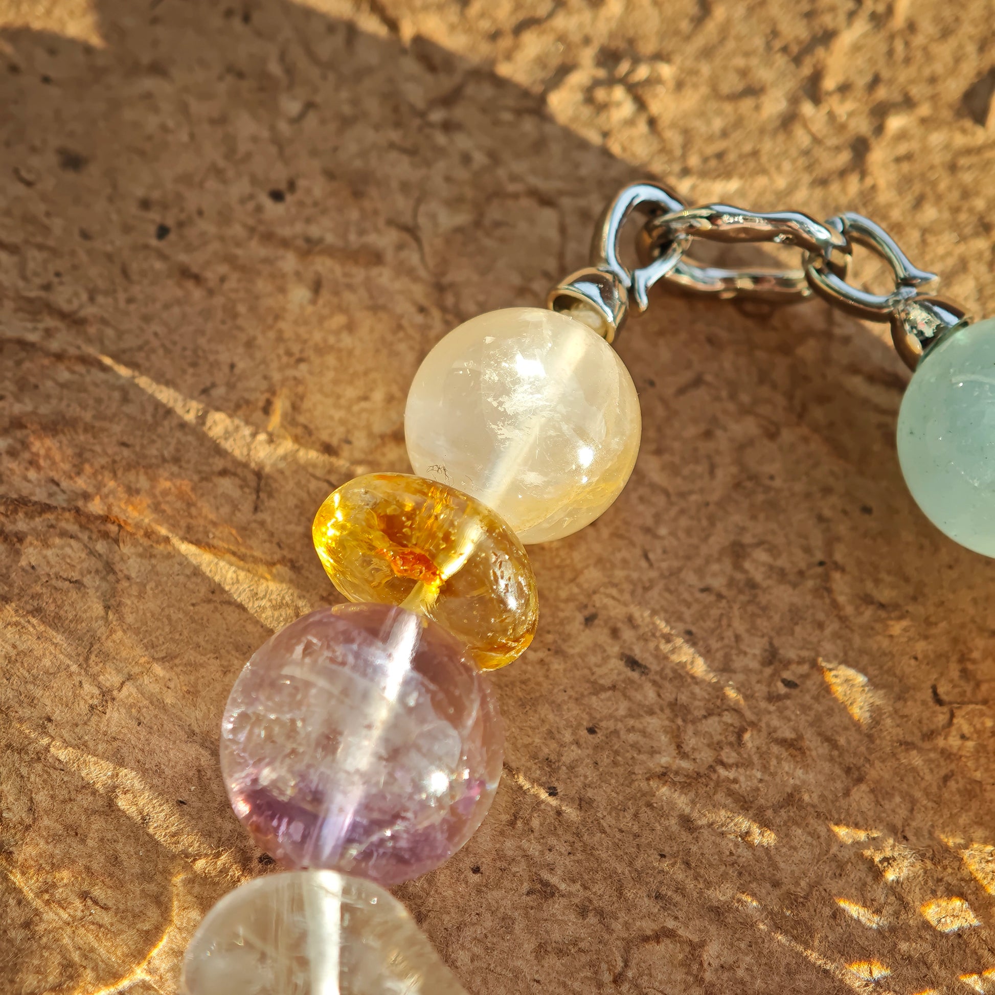 Dreamy pastel tones—sea blue, baby pink, crystal, sunshine, and lilac—live in one bracelet.