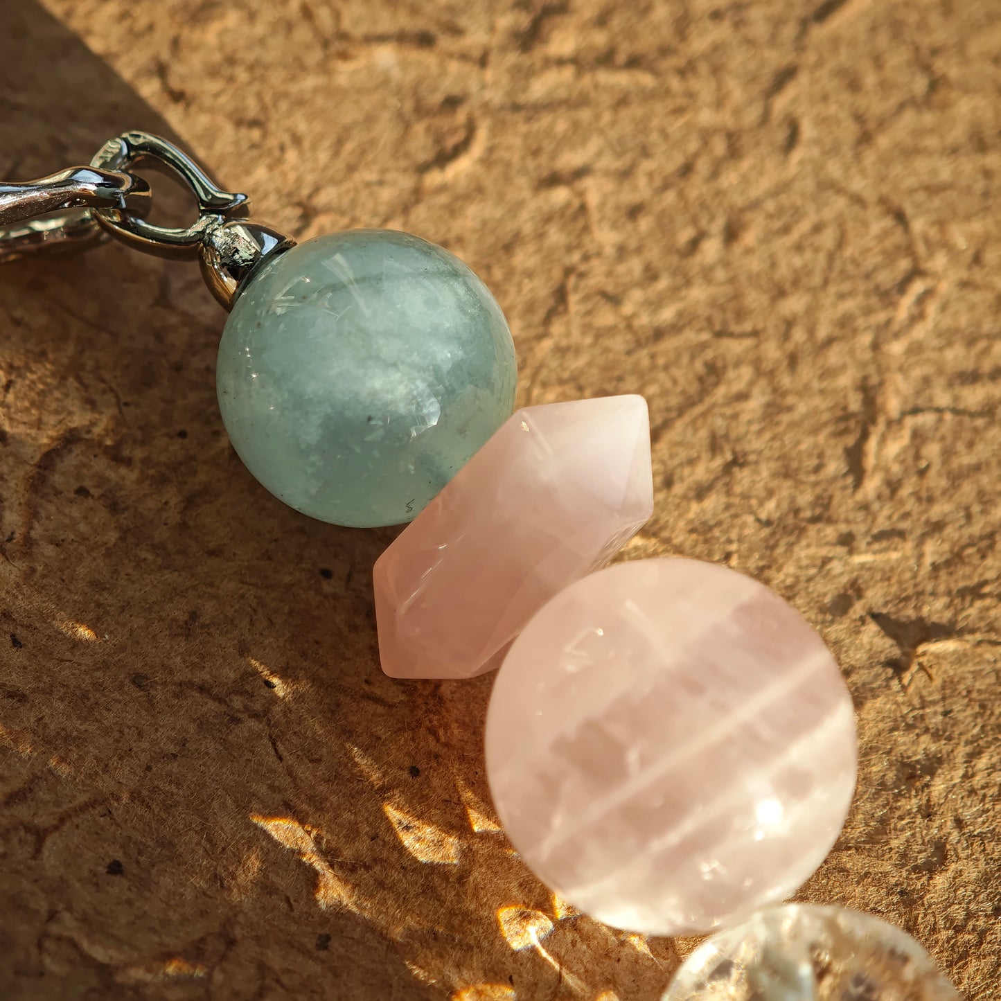 Wear five pastel crystals: aquamarine, rose quartz, clear quartz, citrine, and amethyst in sweet harmony.

