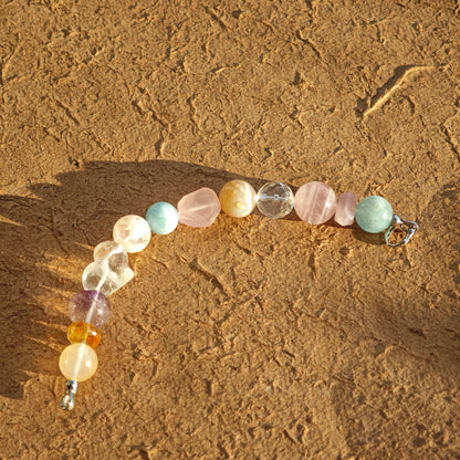 Macaron shades swirl in every bead—aquamarine, rose quartz, clear quartz, citrine, and amethyst.