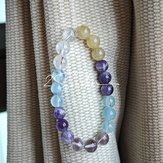 This is a gemstone bracelet consists of different gemstones. They are blue aquamarines, purple amethysts, yellow citrines and transparent clear quartz. It's with 16cm circumference.