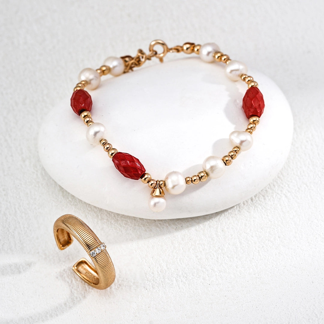 This is a bracelet consist of genuine 925 silver, luminous 5-6mm freshwater pearls, and striking cinnabar. The bracelet measures 16cm with a 3cm extender.