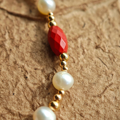 This is a bracelet consist of genuine 925 silver, luminous 5-6mm freshwater pearls, and striking cinnabar. The bracelet measures 16cm with a 3cm extender.