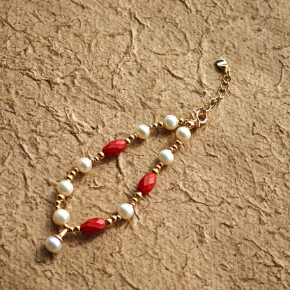 This is a bracelet consist of genuine 925 silver, luminous 5-6mm freshwater pearls, and striking cinnabar. The bracelet measures 16cm with a 3cm extender.