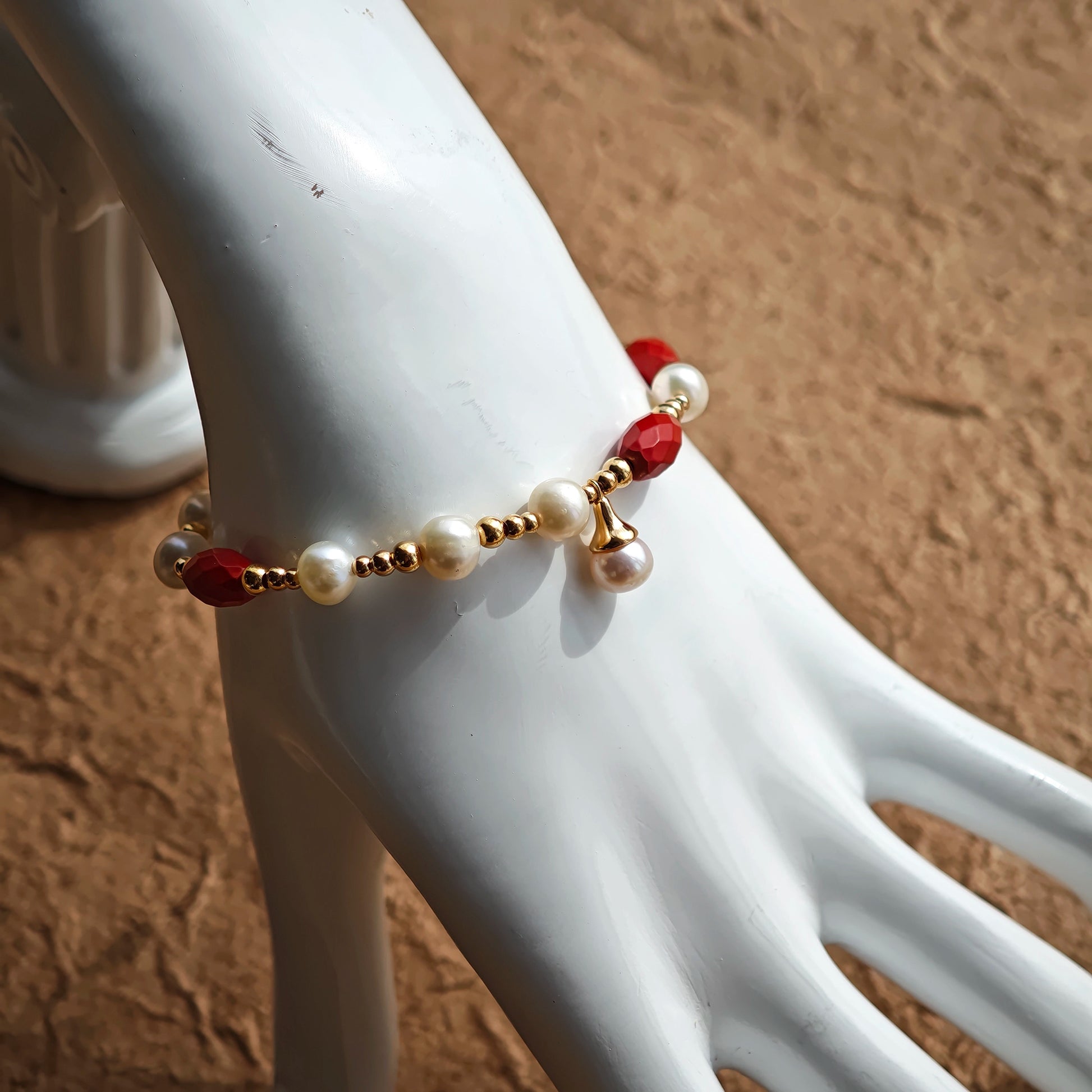 This is a bracelet consist of genuine 925 silver, luminous 5-6mm freshwater pearls, and striking cinnabar. The bracelet measures 16cm with a 3cm extender.