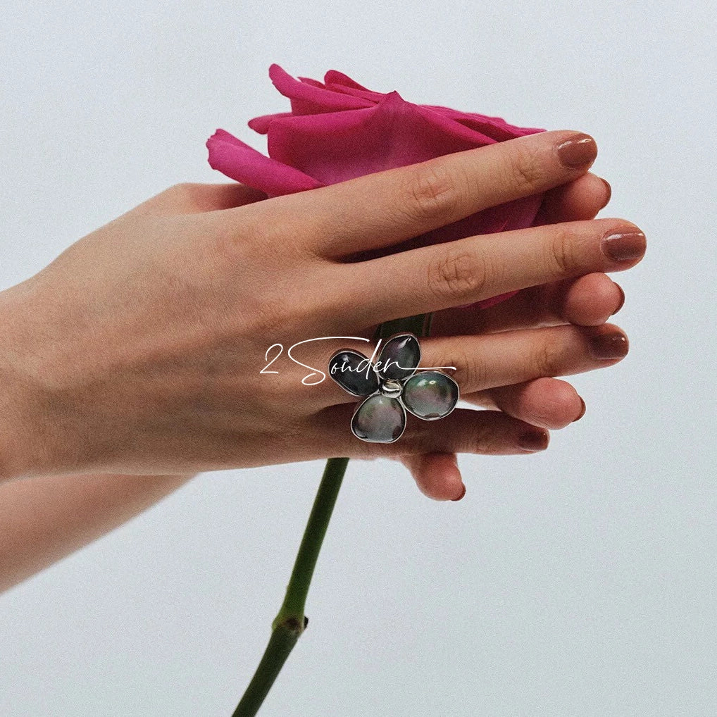 Each piece in this ring and earring set is meticulously crafted from natural mother-of-pearl, showcasing its naturally radiant luster. The large floral design is the main feature of the ring, with rich, vintage-inspired colors and unique natural textures, making each piece one-of-a-kind.