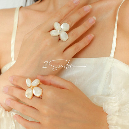 Each piece in this ring and earring set is meticulously crafted from natural mother-of-pearl, showcasing its naturally radiant luster. The large floral design is the main feature of the ring, with rich, vintage-inspired colors and unique natural textures, making each piece one-of-a-kind.