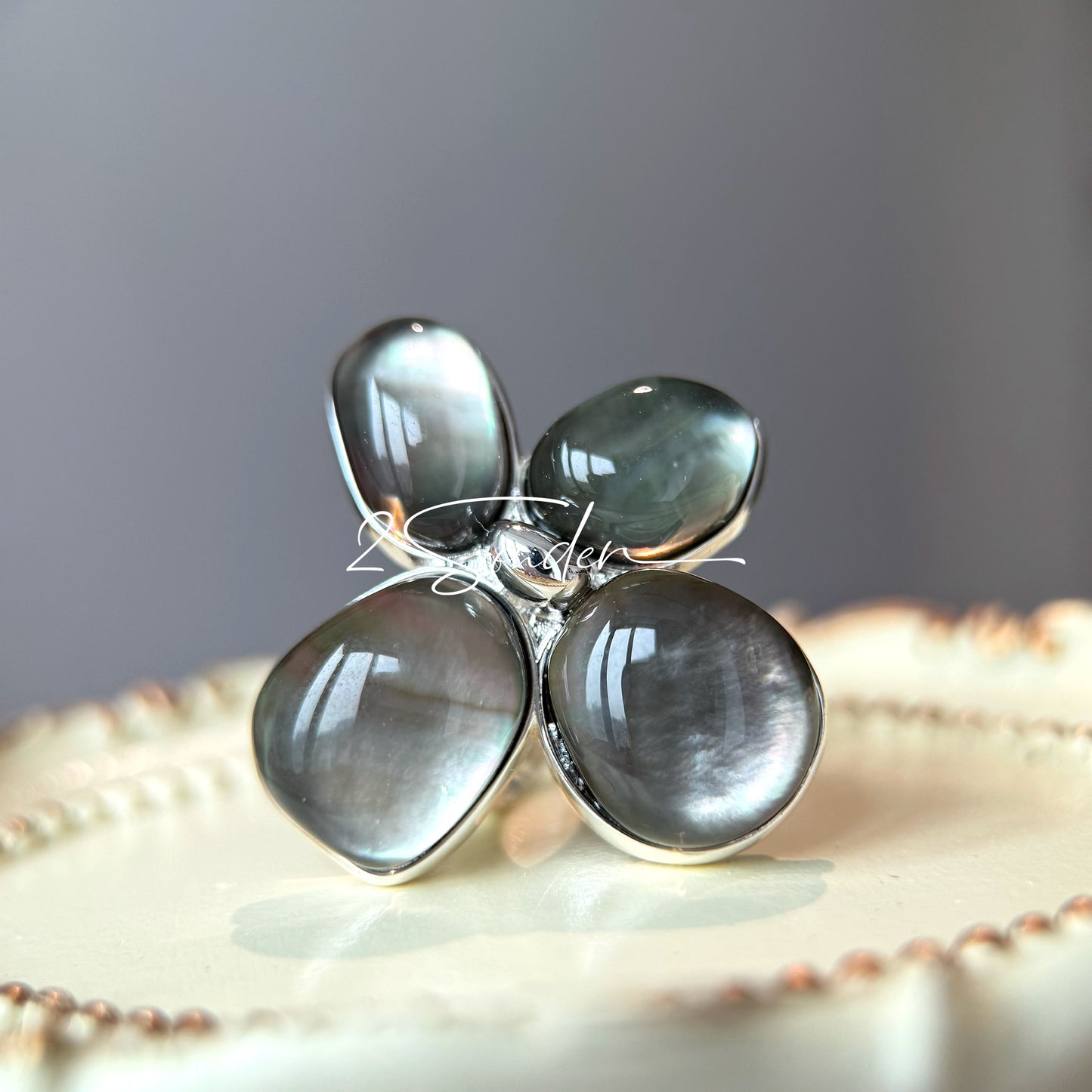 Each piece in this ring and earring set is meticulously crafted from natural mother-of-pearl, showcasing its naturally radiant luster. The large floral design is the main feature of the ring, with rich, vintage-inspired colors and unique natural textures, making each piece one-of-a-kind.