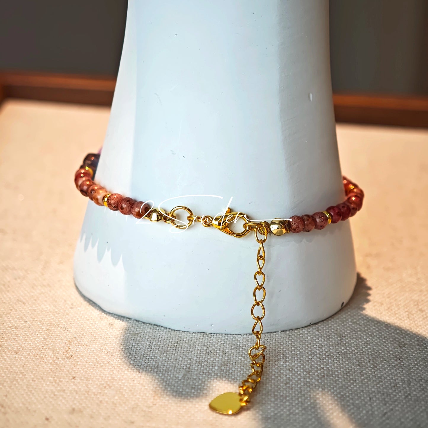 This is a bracelet that made of Czech beads. And it's highlighted by blue, purple, and black flower charms and green leaf accents, creating a stunningly attractive design.