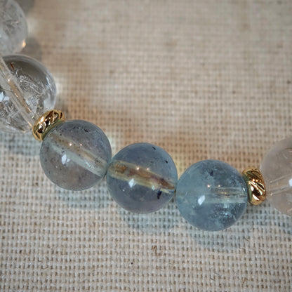 Sea-blue aquamarine meets golden rutile beads, linked by gilded spacers—like ocean waves kissed by sunlight.