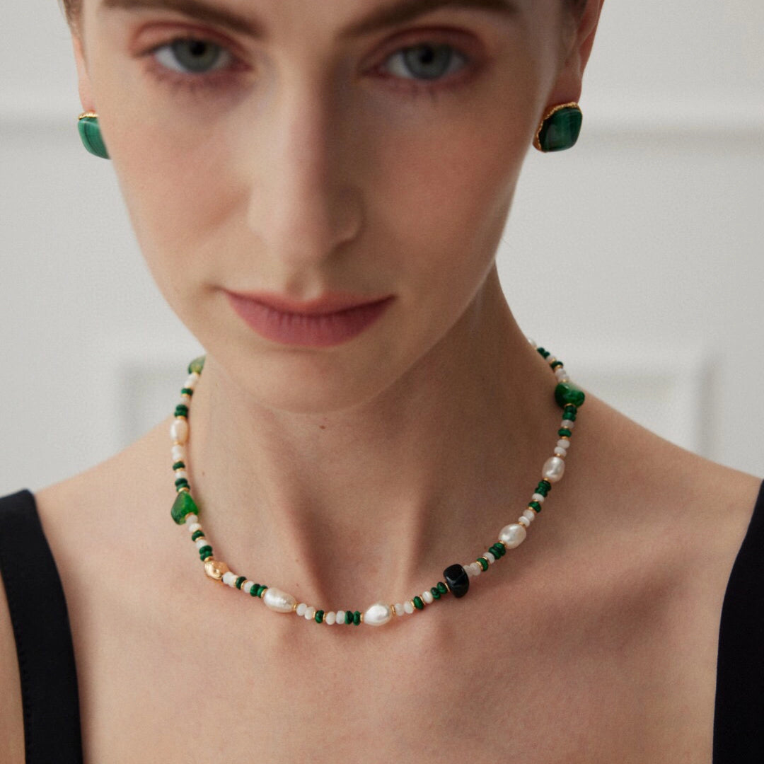 This is a necklace consist of 925 sterling silver with a vintage gold finish, featuring real pearls, malachite, and green agate. The chain is 36cm with a 7cm extender, ensuring it lays beautifully.