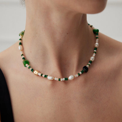 This is a necklace consist of 925 sterling silver with a vintage gold finish, featuring real pearls, malachite, and green agate. The chain is 36cm with a 7cm extender, ensuring it lays beautifully.