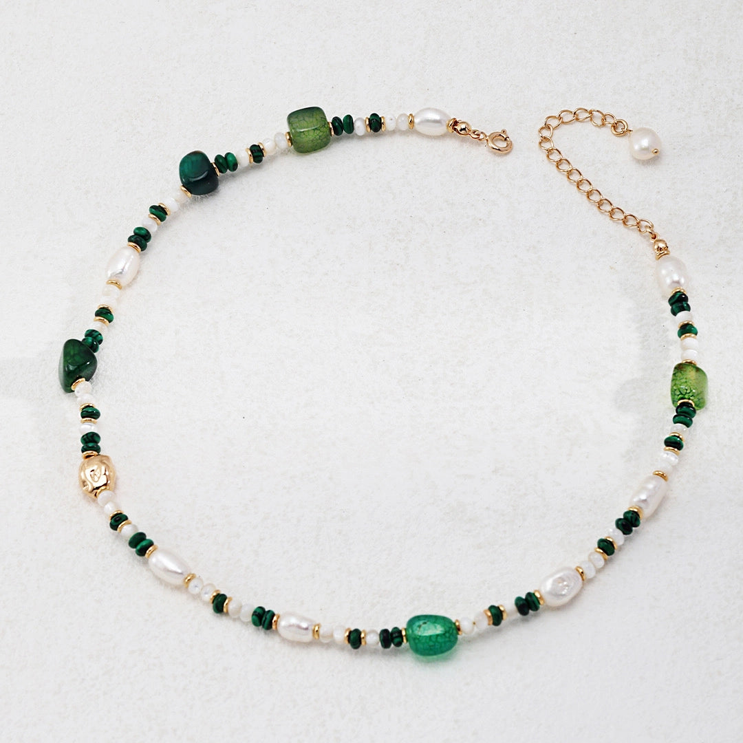 This is a necklace consist of 925 sterling silver with a vintage gold finish, featuring real pearls, malachite, and green agate. The chain is 36cm with a 7cm extender, ensuring it lays beautifully.