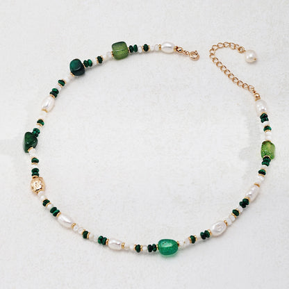 This is a necklace consist of 925 sterling silver with a vintage gold finish, featuring real pearls, malachite, and green agate. The chain is 36cm with a 7cm extender, ensuring it lays beautifully.