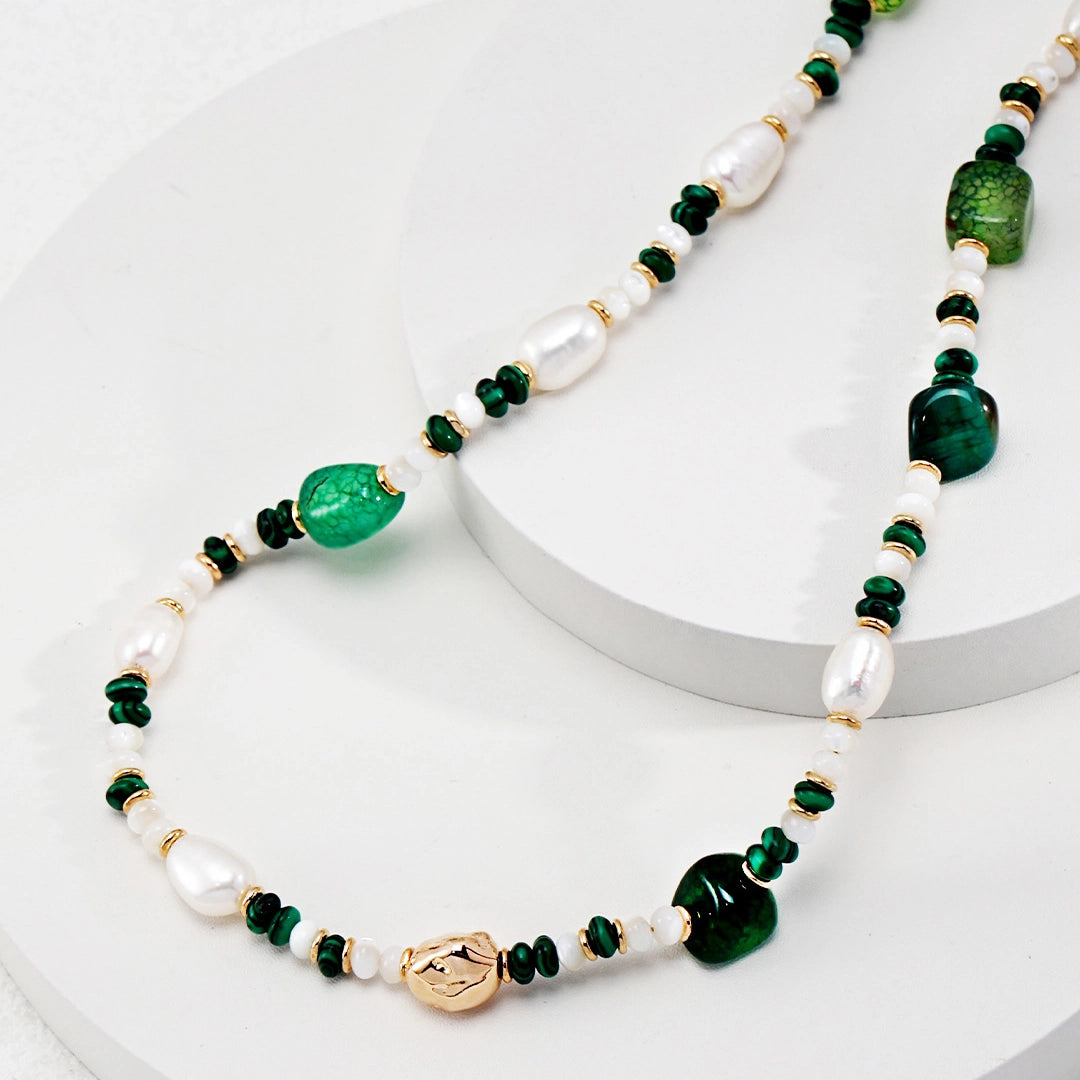 This is a necklace consist of 925 sterling silver with a vintage gold finish, featuring real pearls, malachite, and green agate. The chain is 36cm with a 7cm extender, ensuring it lays beautifully.