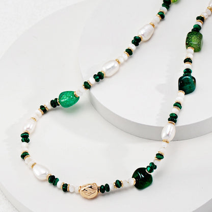 This is a necklace consist of 925 sterling silver with a vintage gold finish, featuring real pearls, malachite, and green agate. The chain is 36cm with a 7cm extender, ensuring it lays beautifully.
